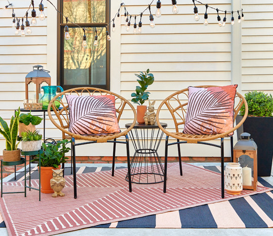 Backyard with outdoor patio furniture and chairs, outdoor rugs & pillows, and garden & patio decor from pOpshelf.