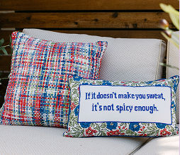 Colorful decorative pillows from pOpshelf featuring funny sayings and trending prints.