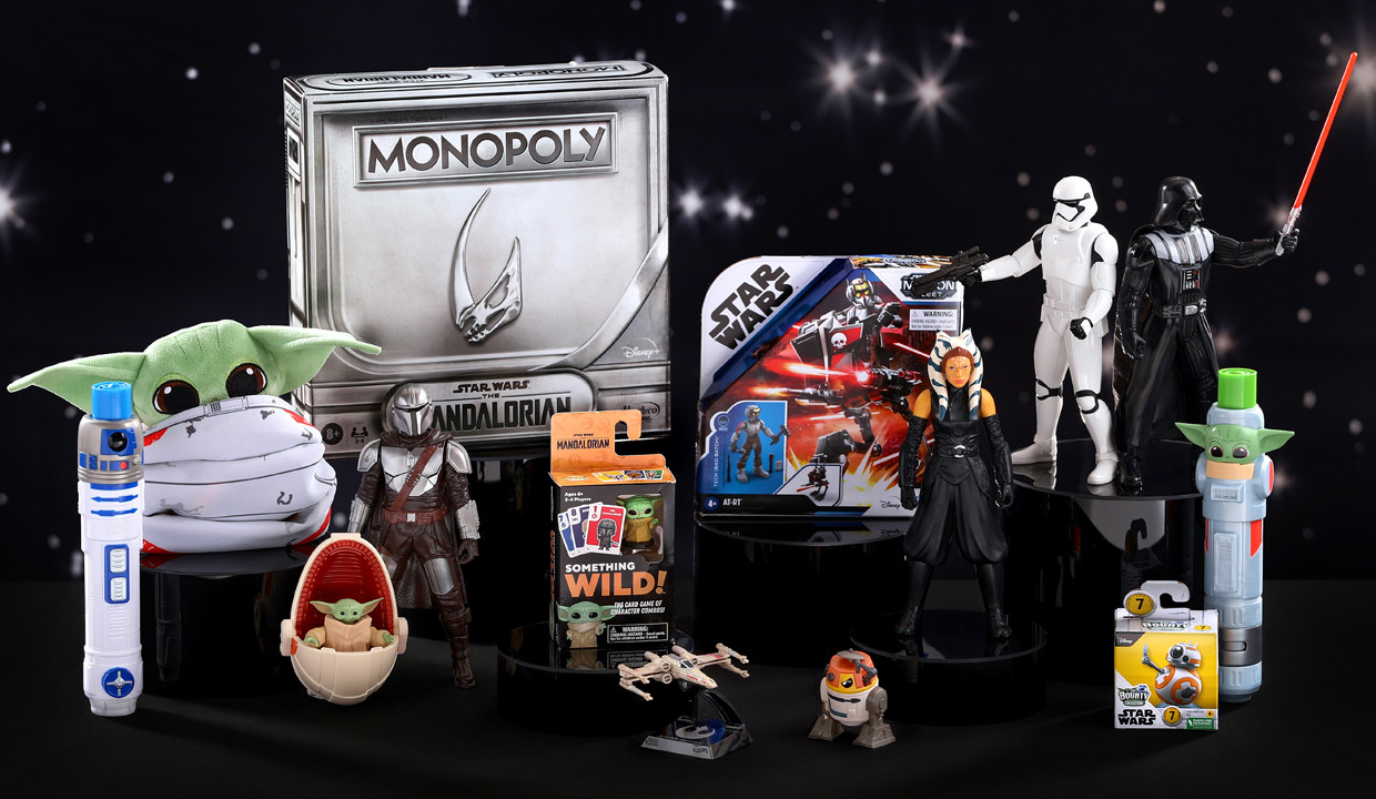 Star Wars and Mandalorian toys from pOpshelf on a black starry background.