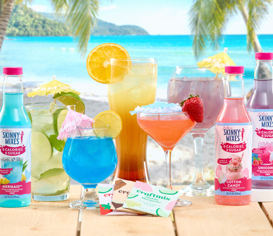 Glassware with colorful cocktails, Skinny Mixes, and Craft cocktail mixes.