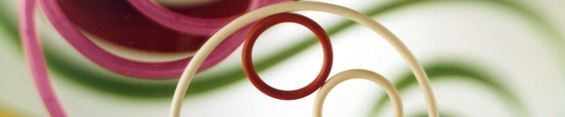 Molded SILASTIC fluorosilicone rubber parts, including O-rings, weatherseals, electronic connector insulators and sparkplug boots. 