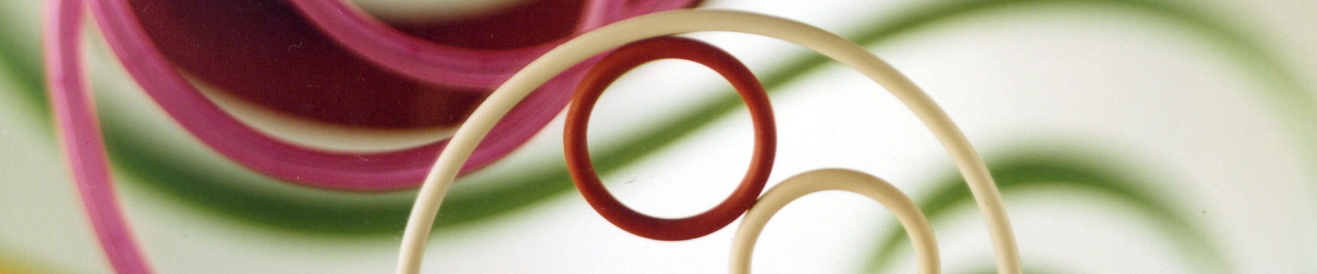 Molded SILASTIC fluorosilicone rubber parts, including O-rings, weatherseals, electronic connector insulators and sparkplug boots. 