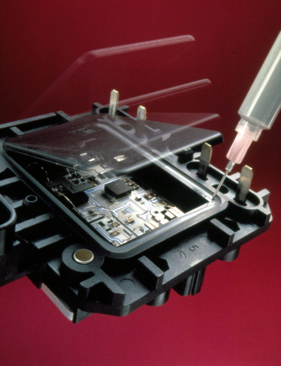 Adhesive applied to seal heatsink assembly.