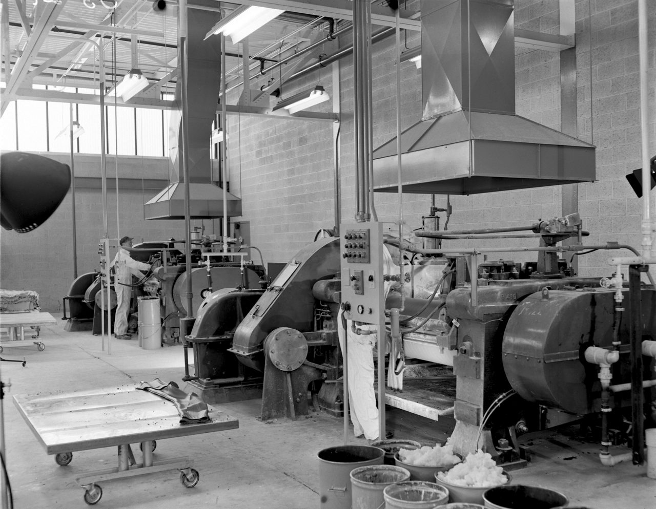 Rolling mills in the Silastic Building at the Midland Plant roll out sheets of Silastic silicone rubber in early 1953 photo by Jim Dion. Photo used in 50th Anniversary Book. Production areas / Midland Plant, Michigan, USA,