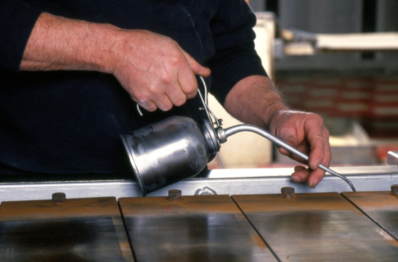 Man's Hands Applying Lubricant