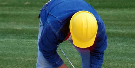 Construction worker applies SL Parking Structure Sealant to seam in concrete sidewalk.] SL Parking Structure Sealant Construction/IBU AProduct brochure