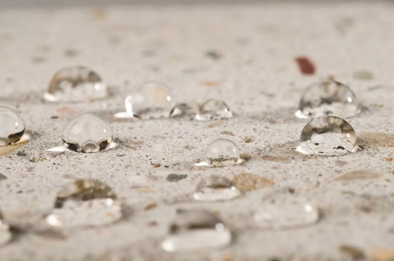 Water beading up on concrete substrate