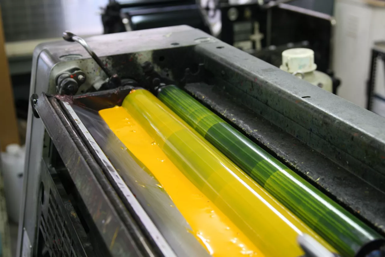 Yellow ink in a one color printing press. / Dreamstime Image #4522595