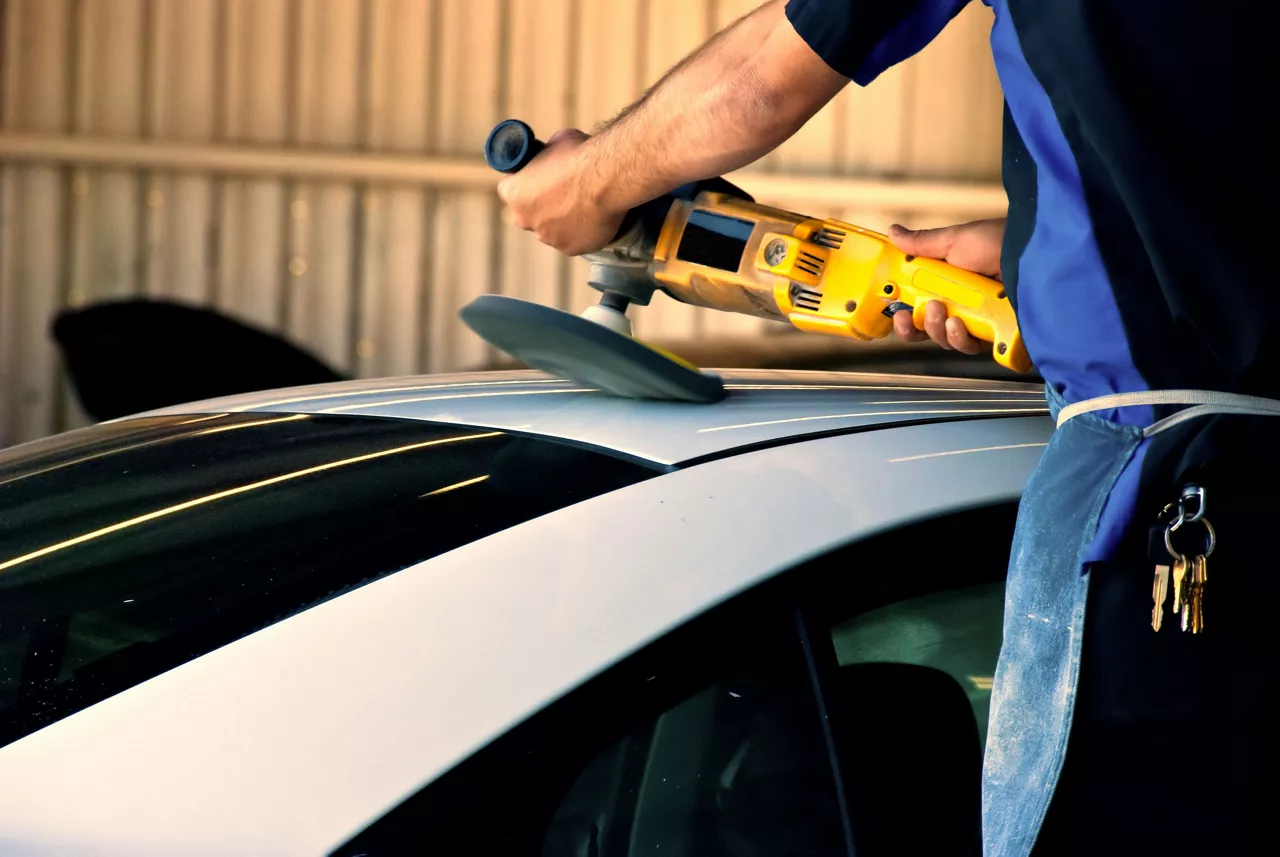 Person waxing car 