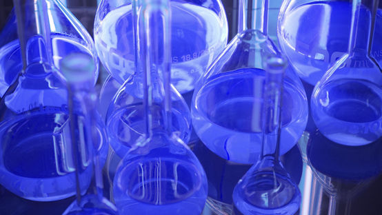 Close up of laboratory flasks containing blue colored liquid. / Dreamstime Image #3755928