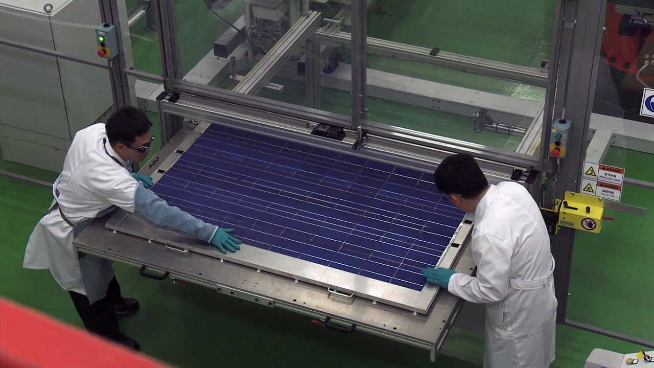 Solar team members working in the labs at the Korea Solar Solutions Application Center.