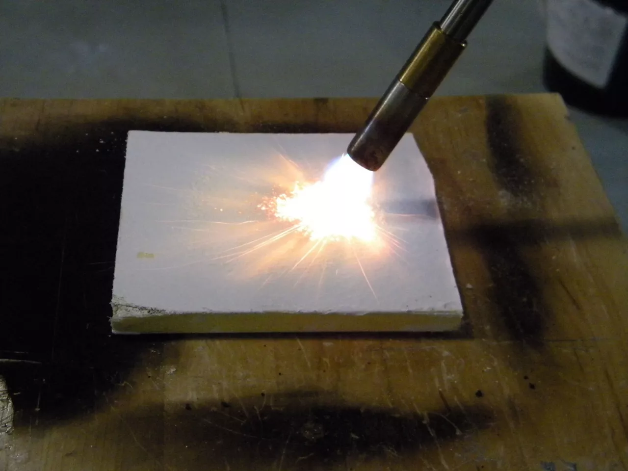 DefendAir air barrier competitive fire testing. Competitive flame spread testing being conducted on competitibe products for comparison with Dow Corning Product.