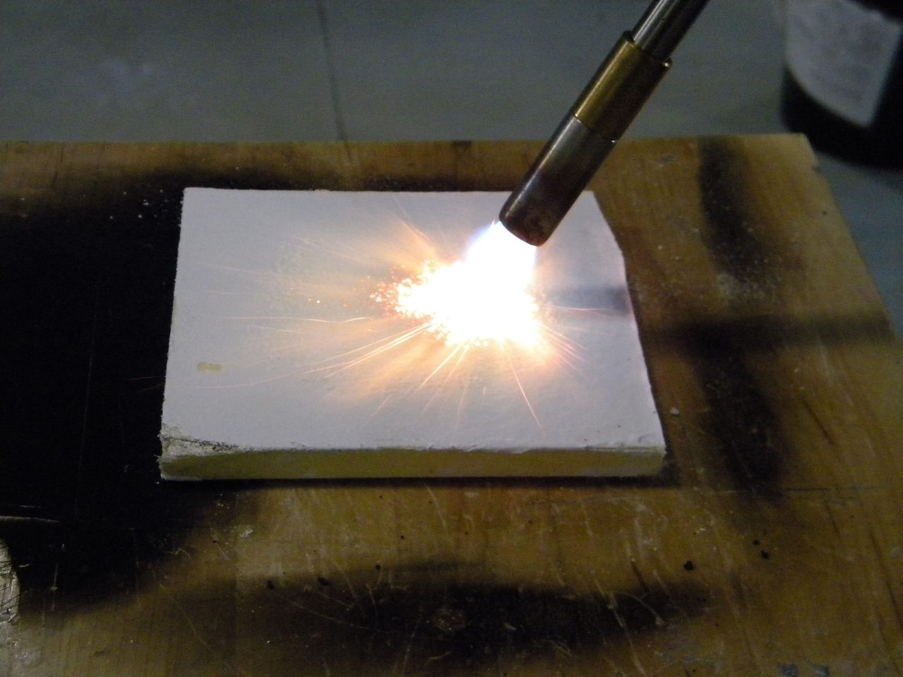Fire rated silicone sealant being tested by torch 