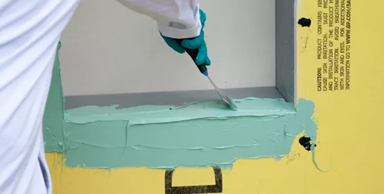 Applying Dow Corning 778 at window opening.