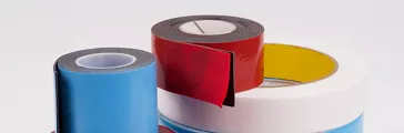 Various rolls of tape on a white background. Used in SYL-OFF brochure.