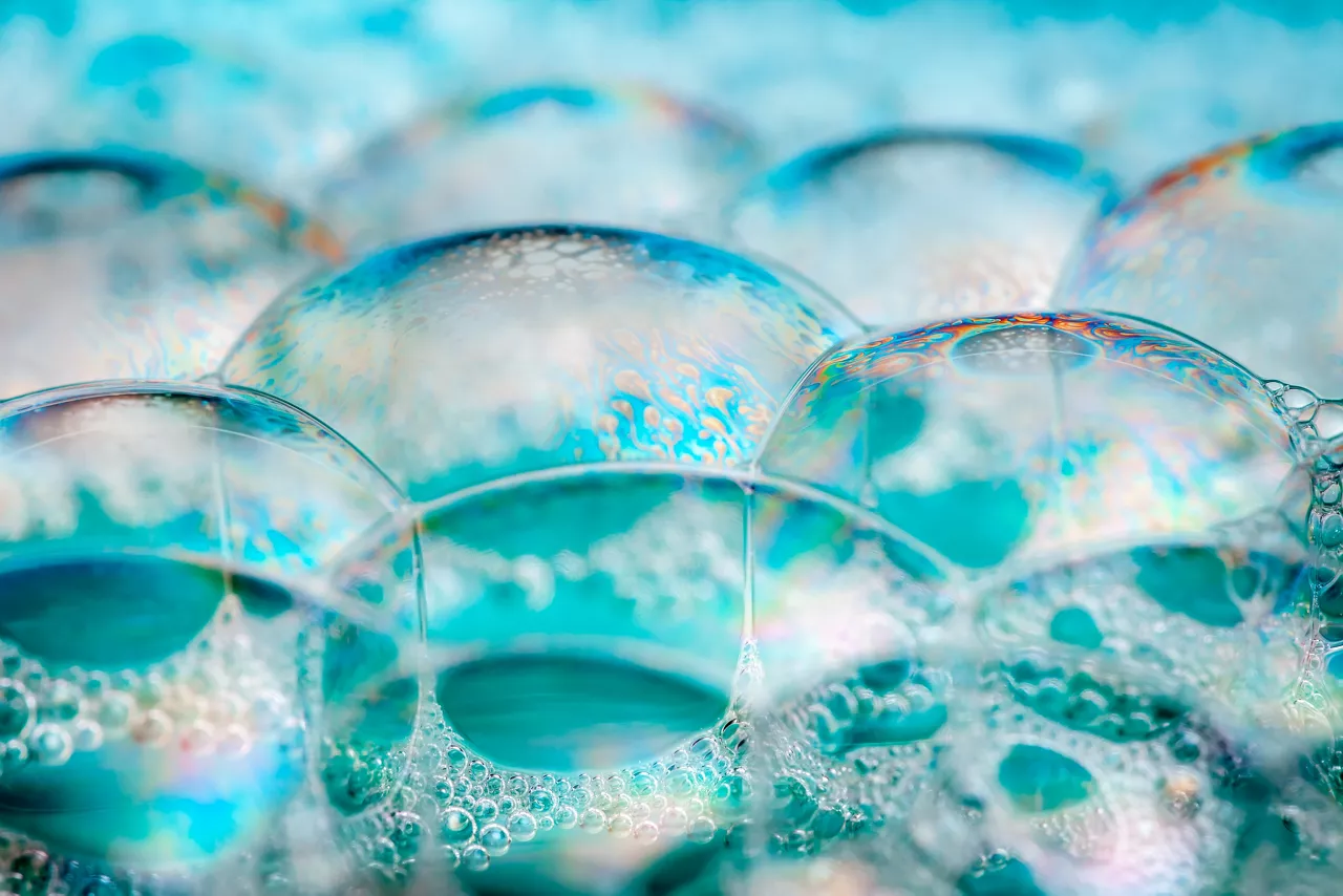 Clean blue soap bubbles and suds