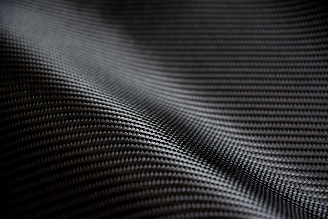 Black carbon fiber composite raw material background