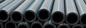 HDPE potable pipes in stacked rows.
