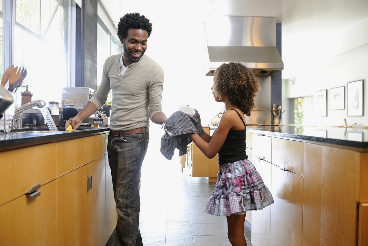 Two people doing dishes