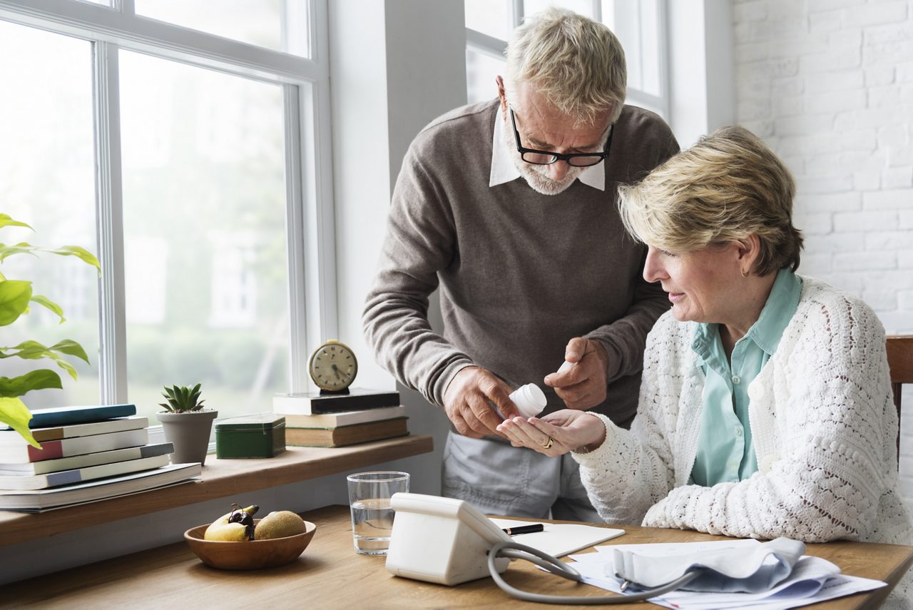 Senior Adult Taking Pills Medicine Concept