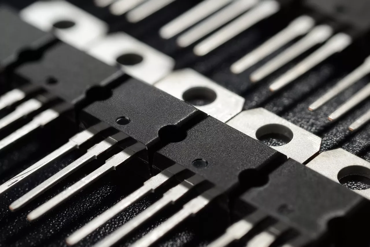 Macro shot of power transistors on the black surface