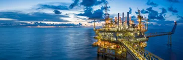 Panorama of Oil and Gas central processing platform in twilight, offshore hard work occupation twenty four working hours.