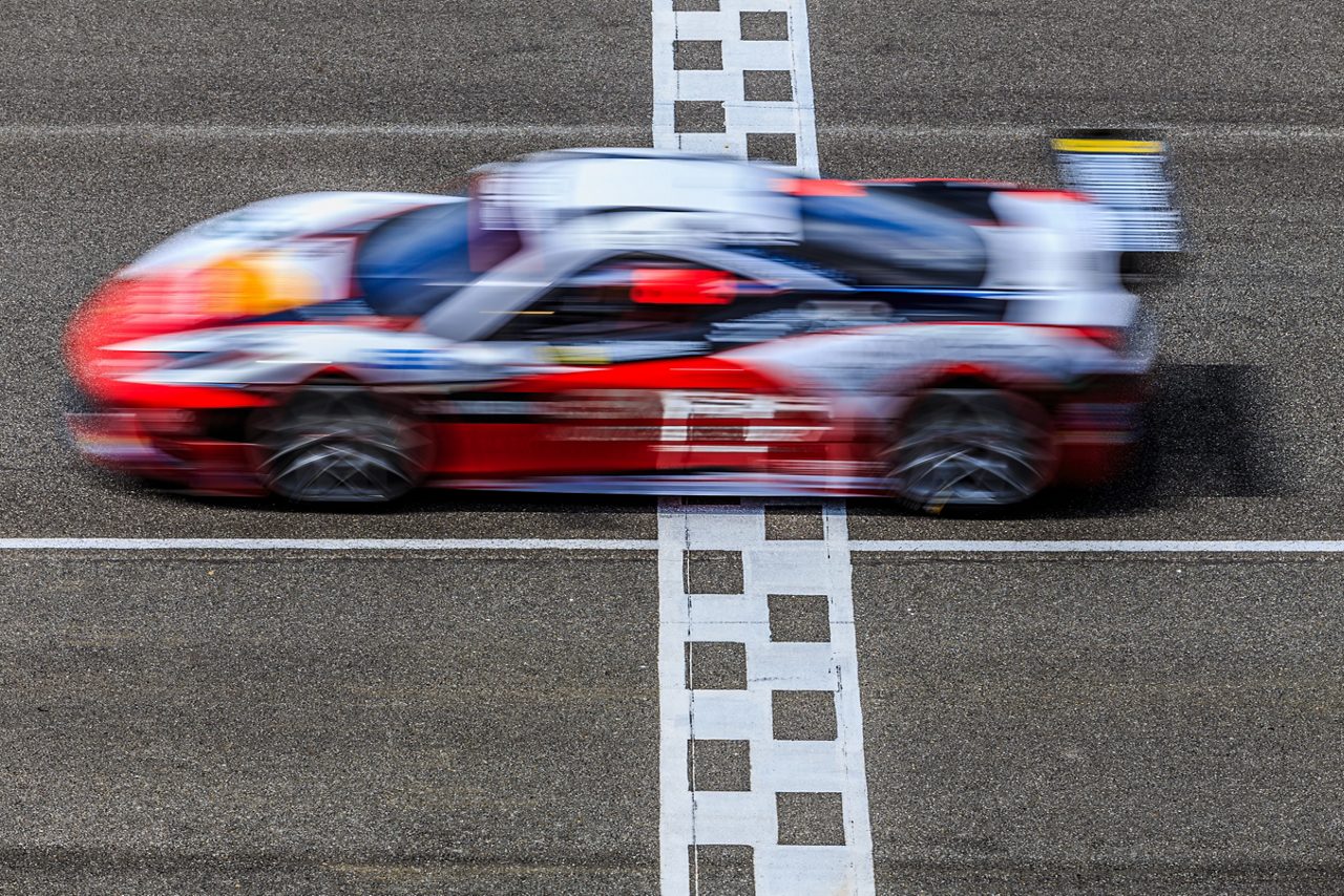 Motion blur, race car racing on a track