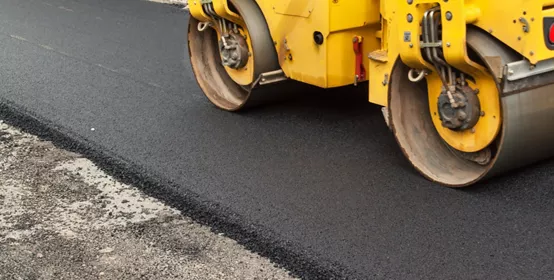 Roller on new asphalt road.