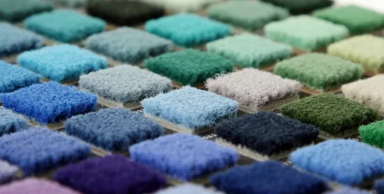 Samples of color of a carpet covering closeup 