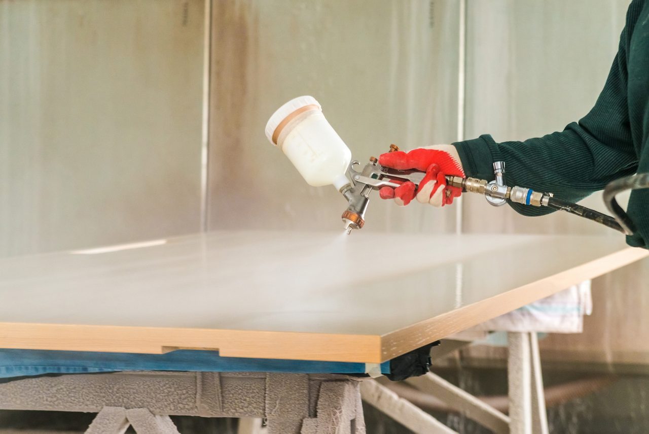 Staining wood with spray gun