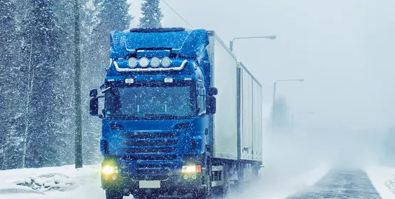 Truck on the road in winter 