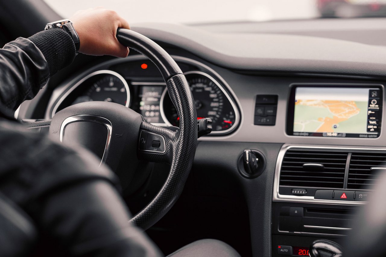 Hands on a steering wheel