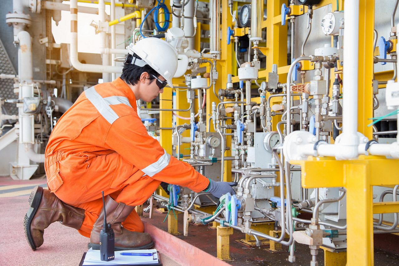 Worker in plant maintaining Silicone Inhibitors