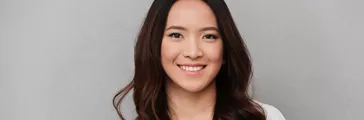 Smiling Asian woman in white shirt