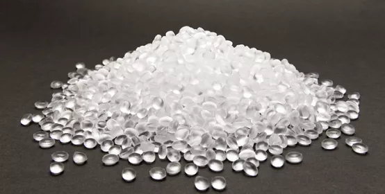 Transparent Polyethylene granules on dark background