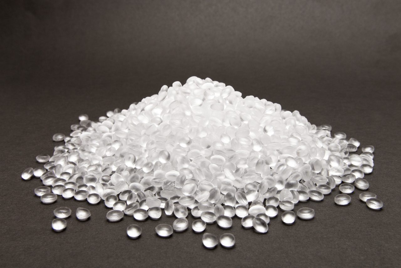 Transparent Polyethylene granules on dark background