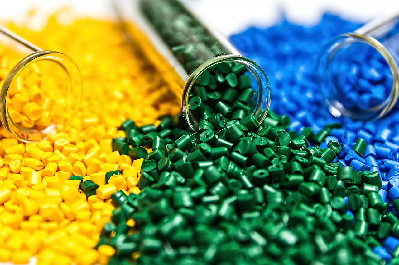 Polymeric dye. Close-up of different colored plastic pellets. Colorant for plastics. Pigment in the granules.
