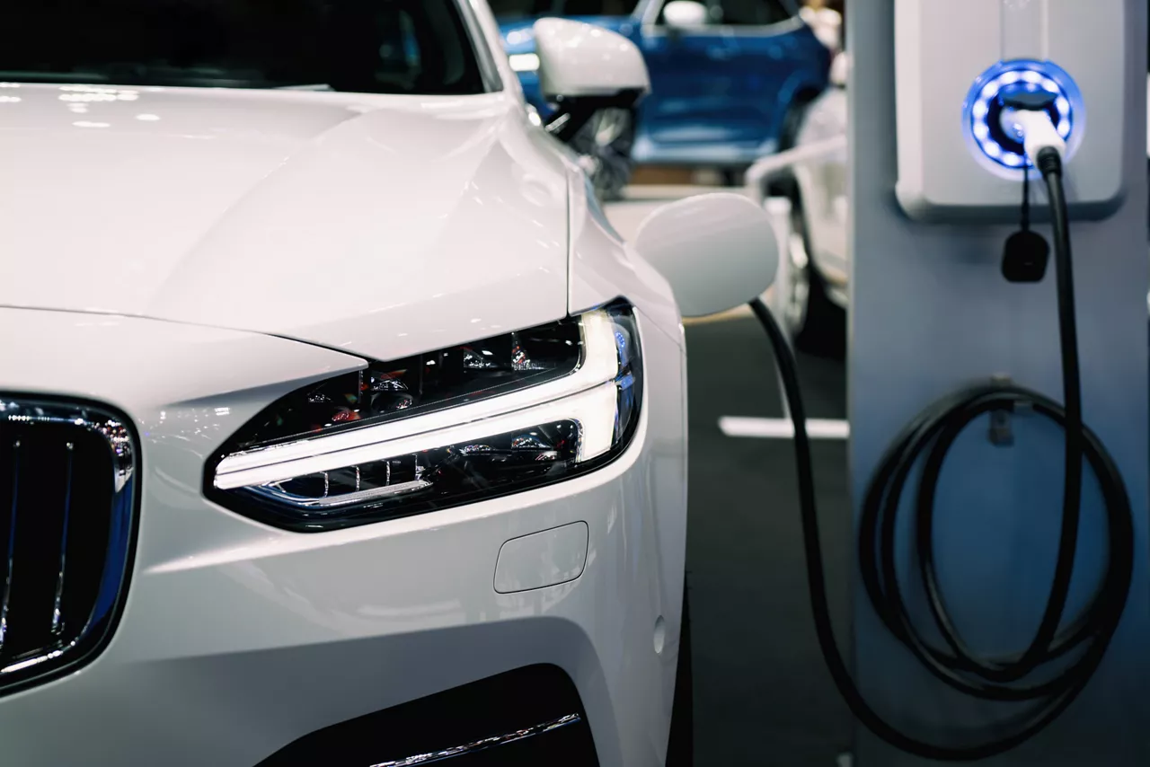 Hybrid electric car at charging station. Eco car concept.