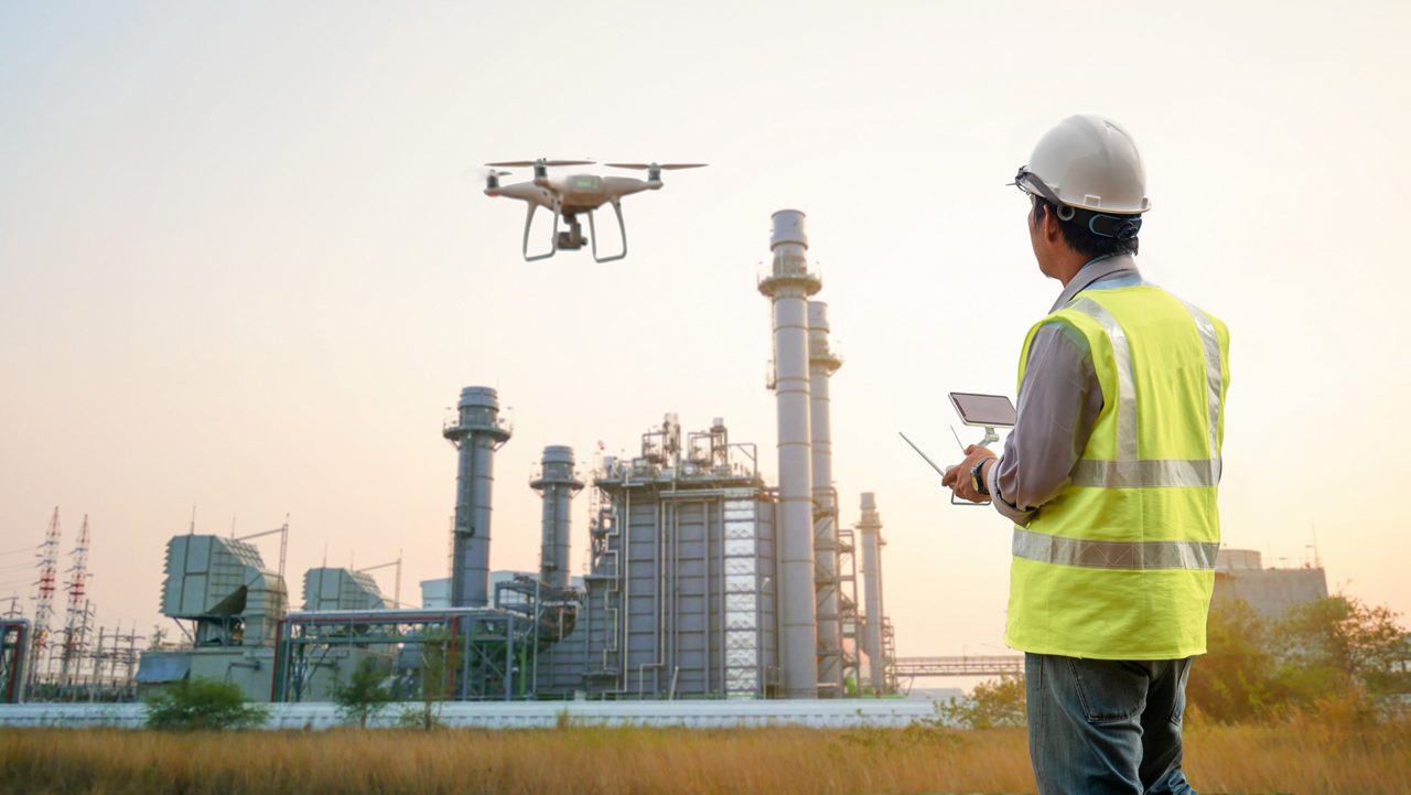 Drone inspection. Operator inspecting construction building  turbine power plant