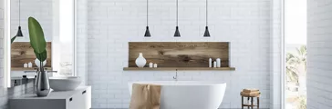 White brick bathroom interior with a concrete floor and a white bathtub