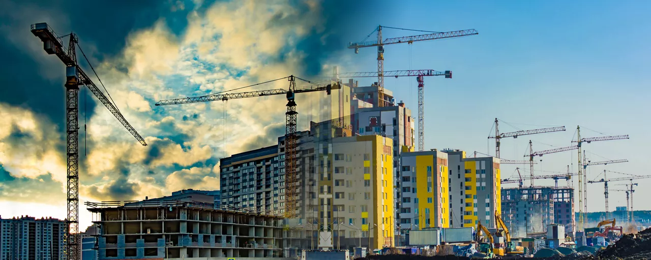 Construction of new buildings, surrounded by cranes