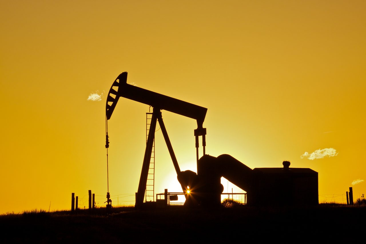 Oil pumpjack in sunset