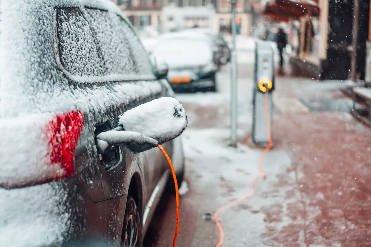 Electric car charging in the snow