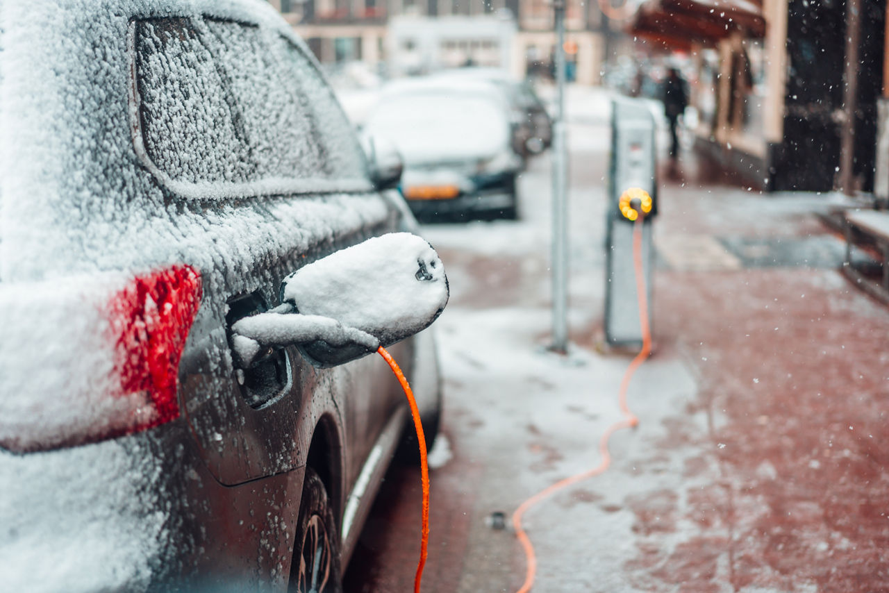 Electric car charging in the snow