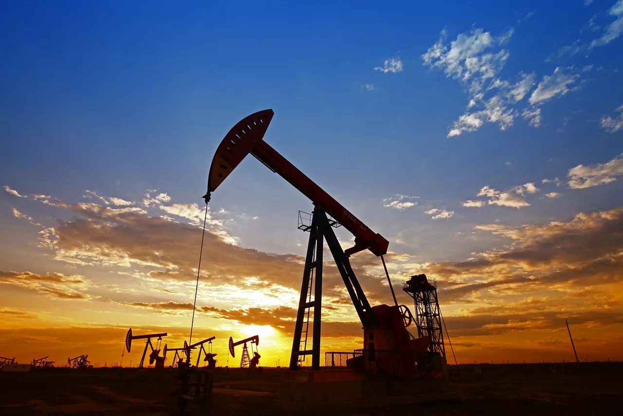 Oil pump silhouette at sunrise