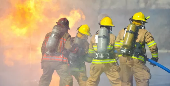  firefighters attack a propane fire during a training exercise