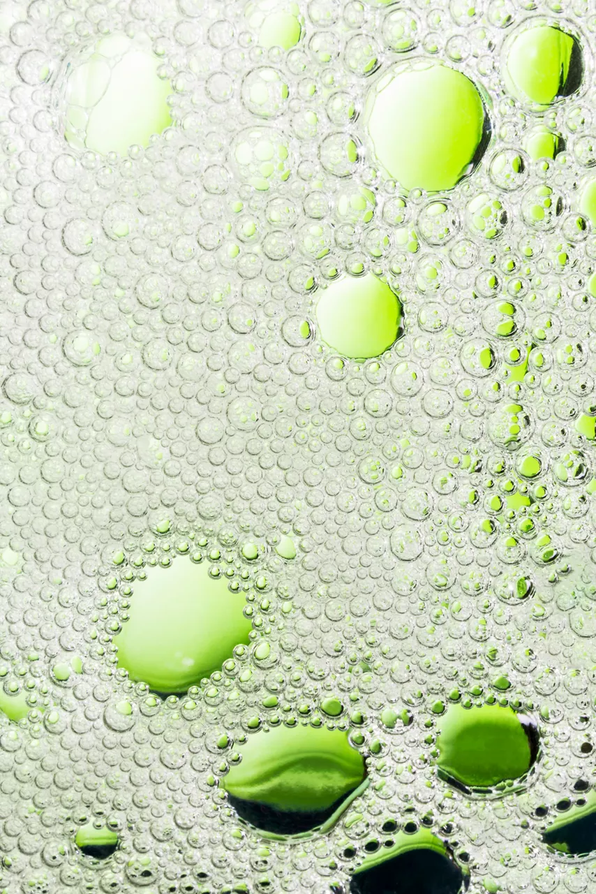 Green bubbles in water, abstract background