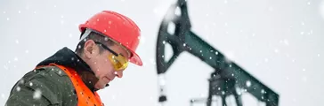 Oil drill in oil and gas field with pump jack and worker 