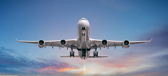 Airplane taking off over runway