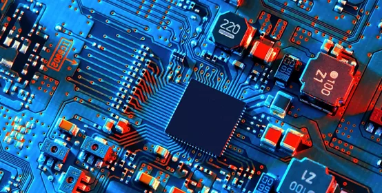 Blue electronic circuit board close up.